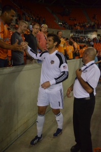 giving high 5s to the fans after the win 